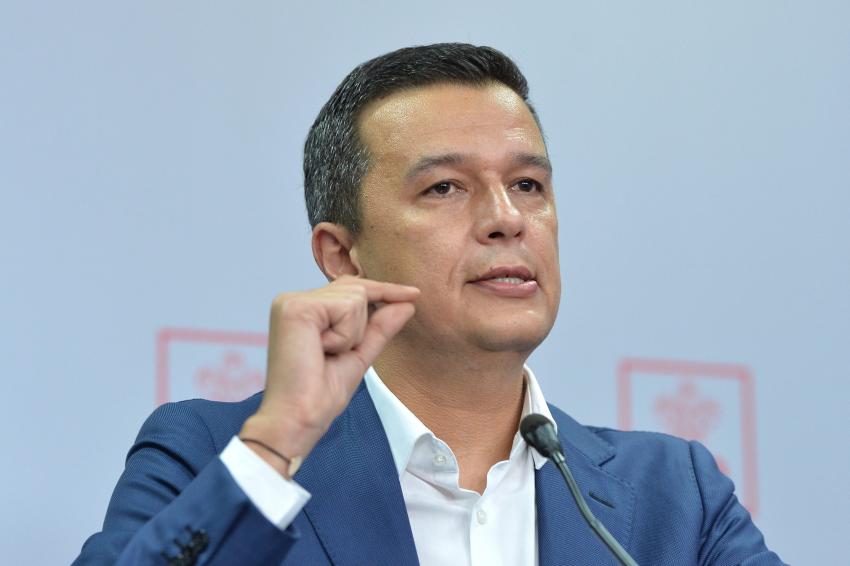 Tensiuni majore în Coaliție: PSD cere demisia lui Bolojan după numirea lui Mihai Savin la Vamă